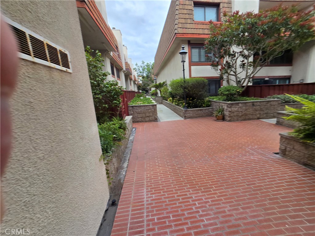 8828 Pershing Drive, Unit 121 Playa del Rey, CA 90293 - Photo 42 of 54 a front view of a house with garden