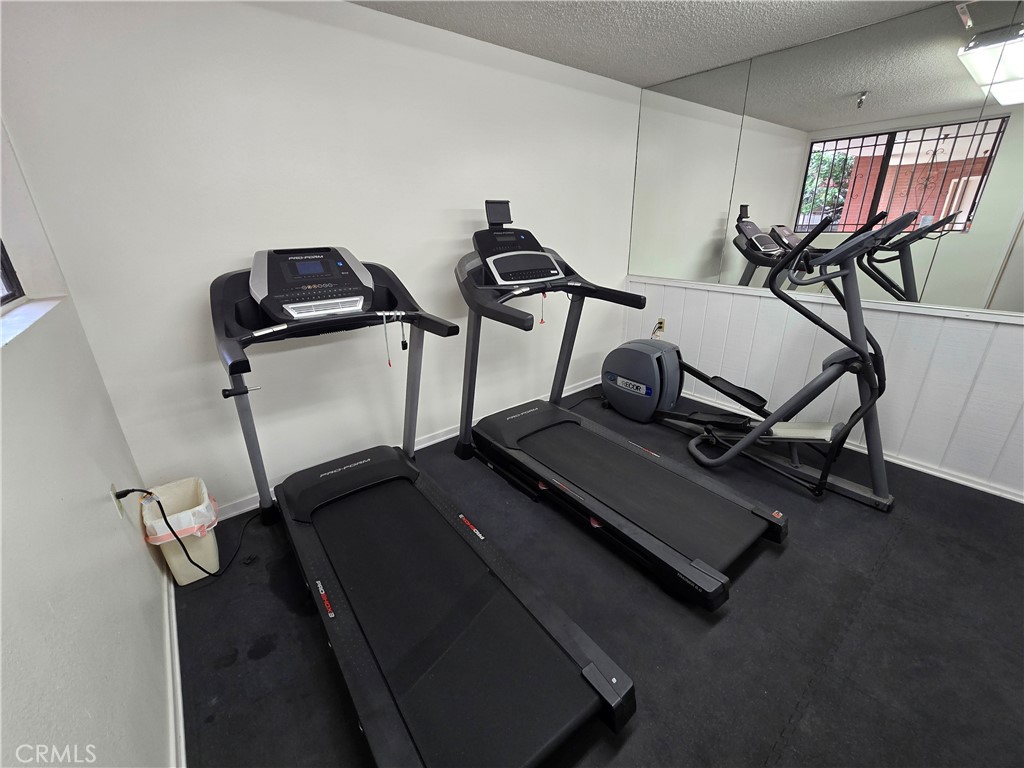 8828 Pershing Drive, Unit 121 Playa del Rey, CA 90293 - Photo 43 of 54 a view of a room with gym equipment