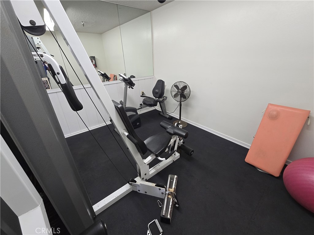 8828 Pershing Drive, Unit 121 Playa del Rey, CA 90293 - Photo 44 of 54 a view of a room with gym equipment