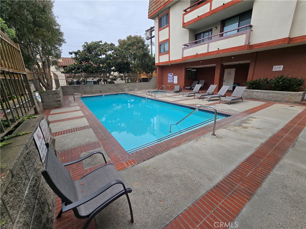 8828 Pershing Drive, Unit 121 Playa del Rey, CA 90293 - Photo 49 of 54 a view of a patio with a table and chairs