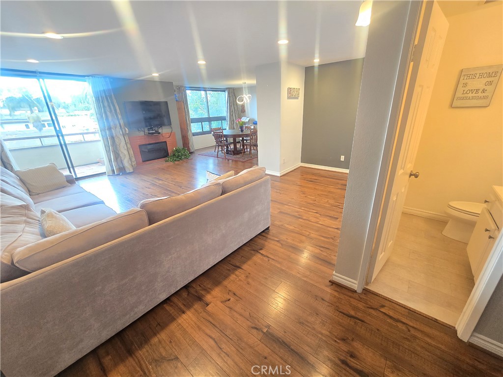 8828 Pershing Drive, Unit 121 Playa del Rey, CA 90293 - Photo 8 of 54 a living room with furniture wooden floor and a large window