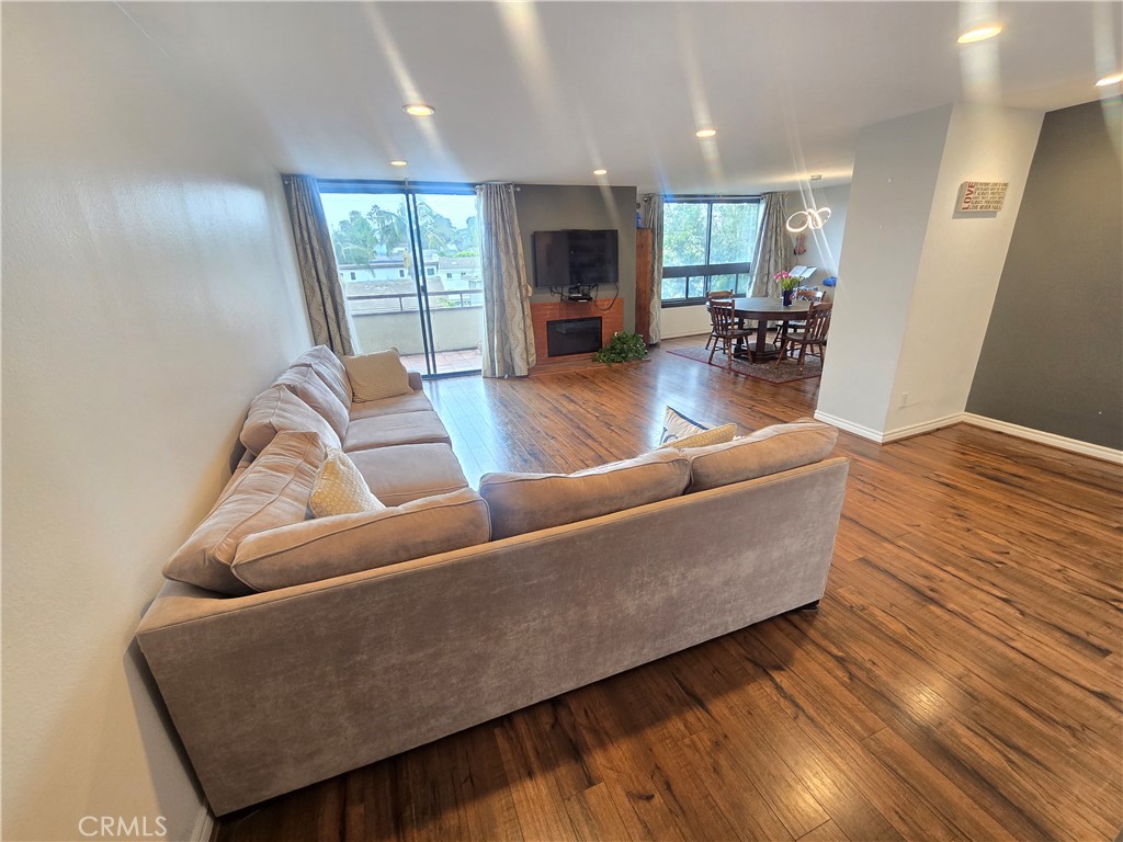 8828 Pershing Drive, Unit 121 Playa del Rey, CA 90293 - Photo 10 of 54 a living room with furniture and a fireplace