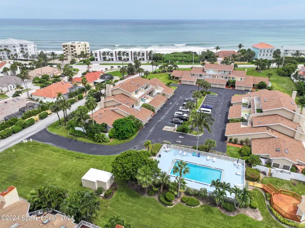 a view of a yard in front of a brick house