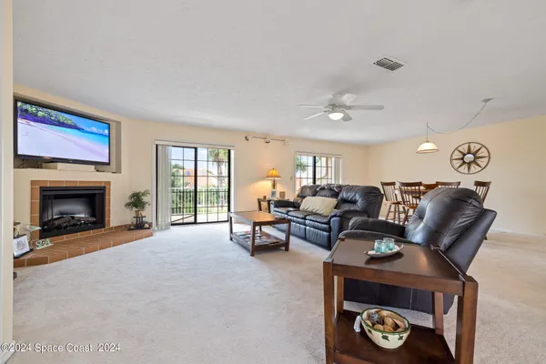 a view of a livingroom with furniture and a window