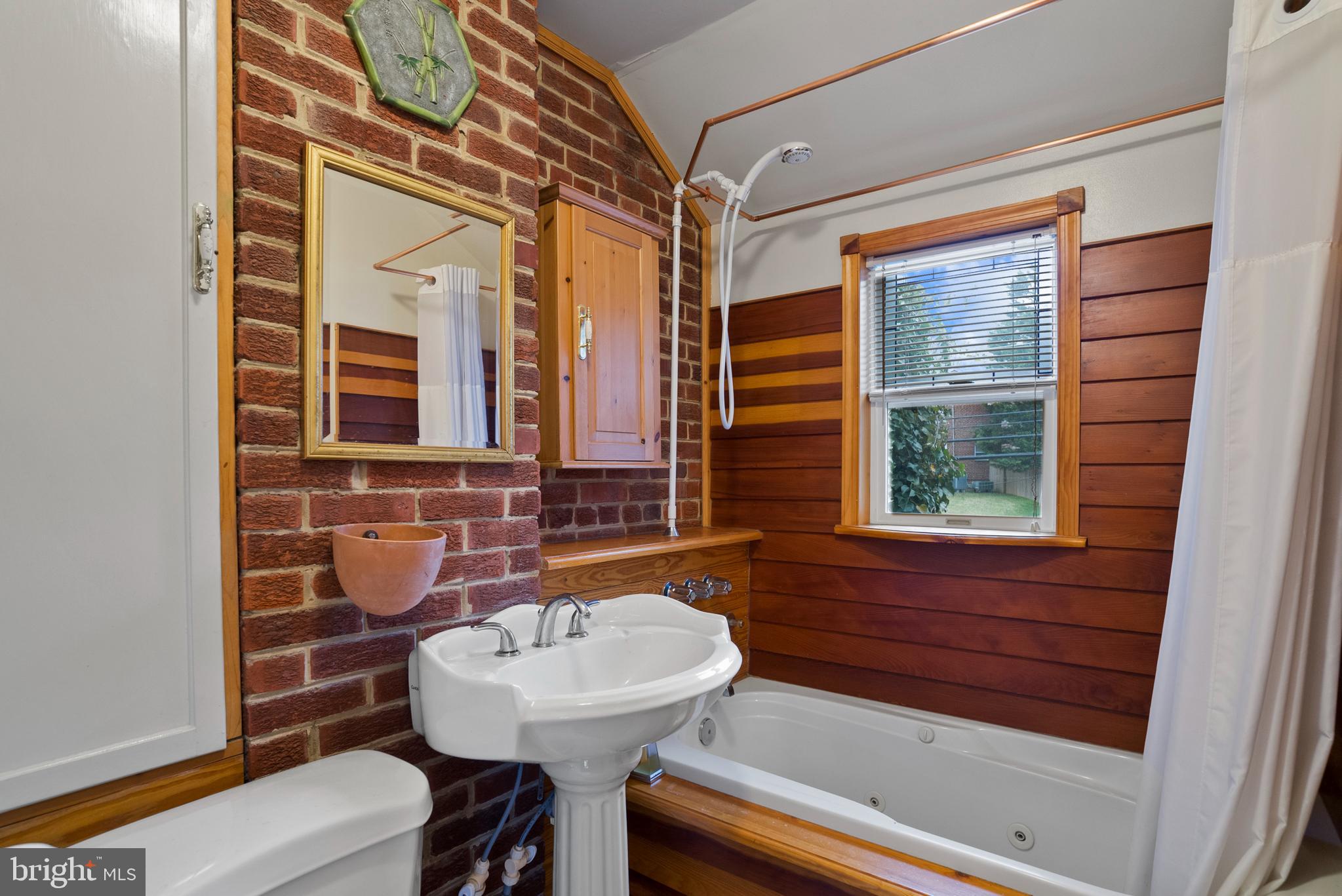 10016 Tenbrook Drive Silver Spring, MD 20901 - Photo 17 of 23 Custom wood paneled primary bathroom.