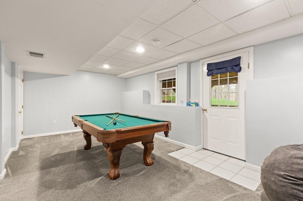 41 Chestnut Road Tyngsborough, MA 01879 - Photo 26 of 32 a room with furniture and a window
