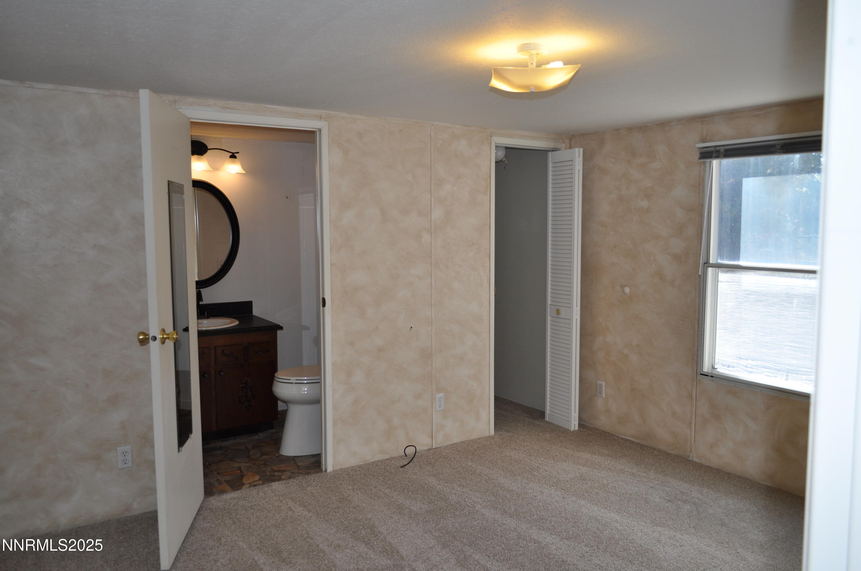 17940 Cold Springs Drive Reno, NV 89508 - Photo 6 of 21 a view of an entryway with wooden floor and mirror