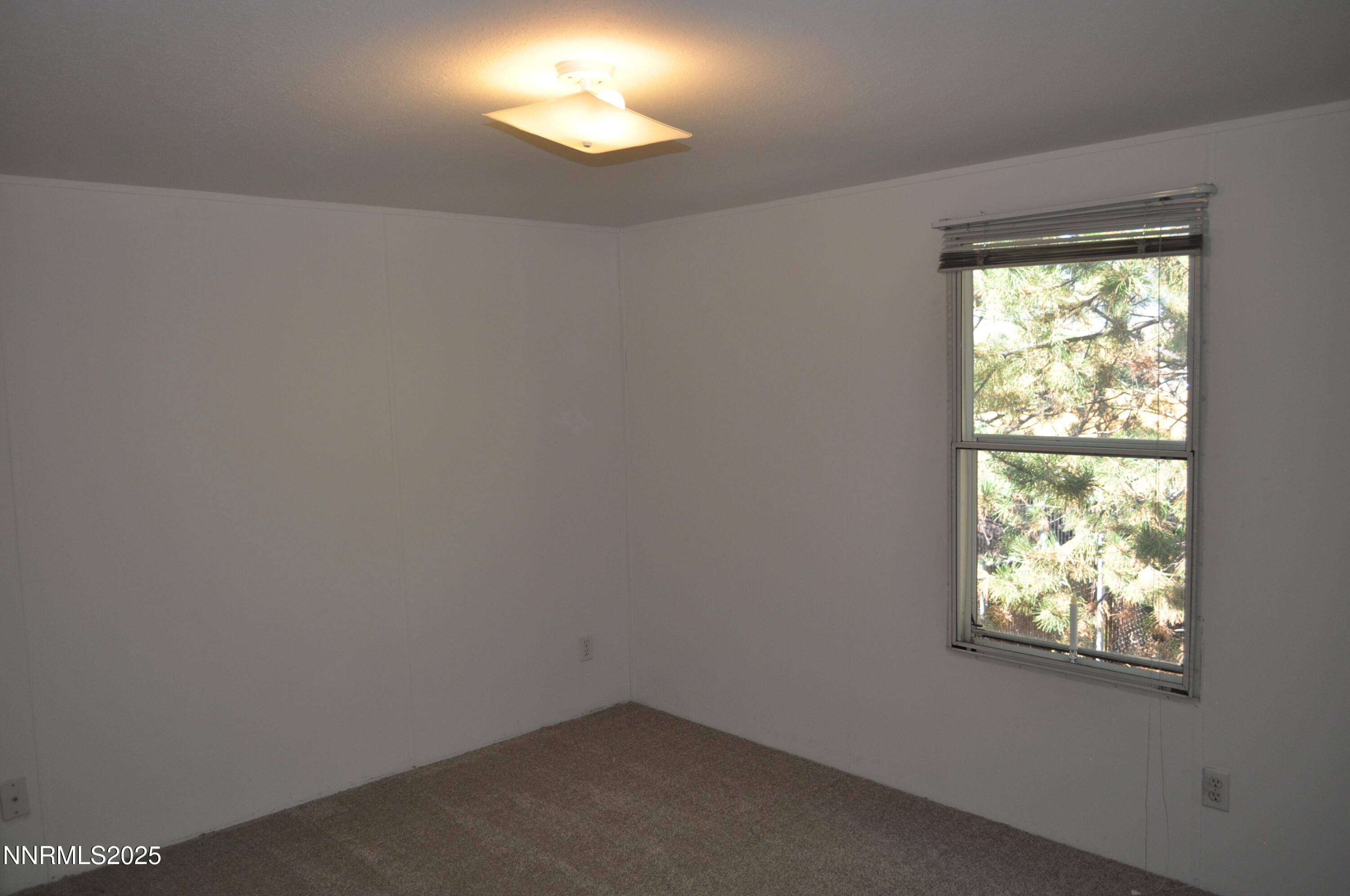 17940 Cold Springs Drive Reno, NV 89508 - Photo 8 of 21 an empty room with a window
