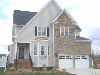 12312 Beestone Lane Raleigh, NC 27614 - Photo 1 of 1 a front view of a house with a yard