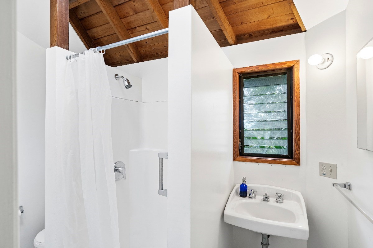 81-1081B Captain Cook Road Captain Cook, HI 96704 - Photo 12 of 24 a bathroom with a sink and a mirror
