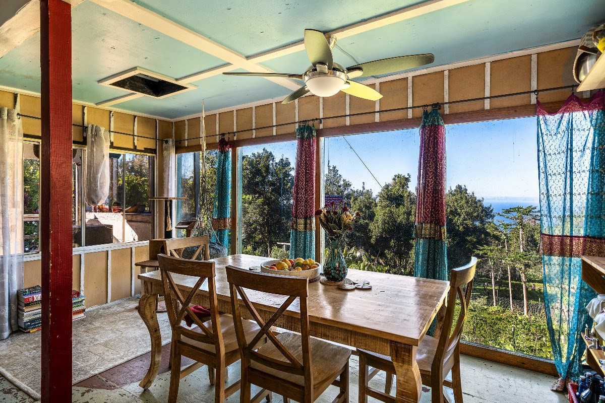 81-1081B Captain Cook Road Captain Cook, HI 96704 - Photo 16 of 24 a view of a patio with a table and chairs