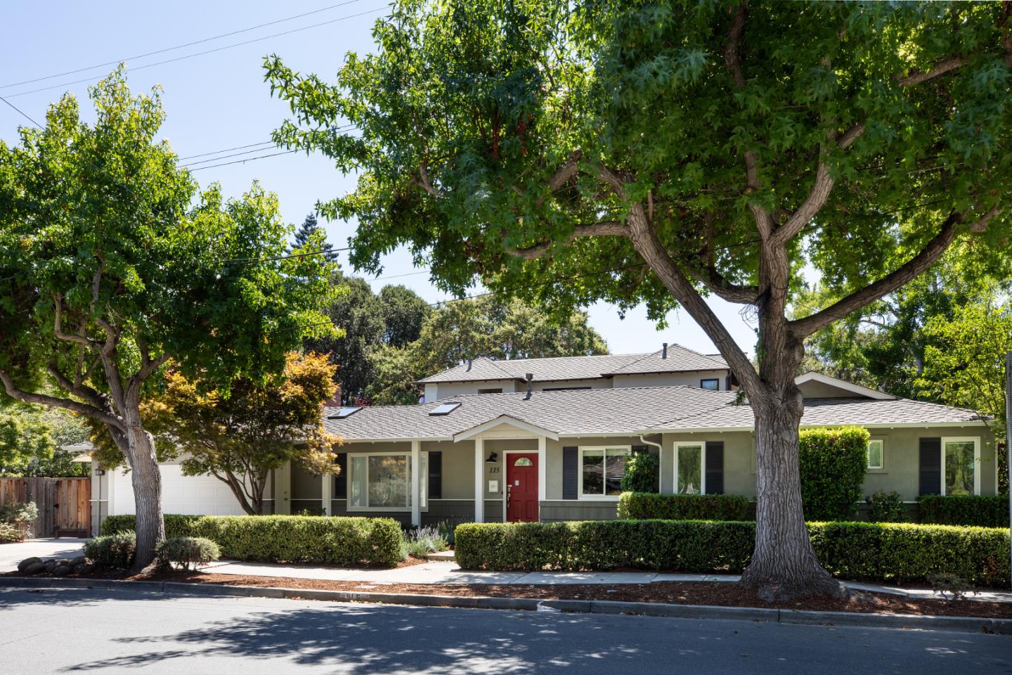 115 Walnut Street Menlo Park, CA 94025 - Photo 1 of 12 a front view of a house with plants and trees