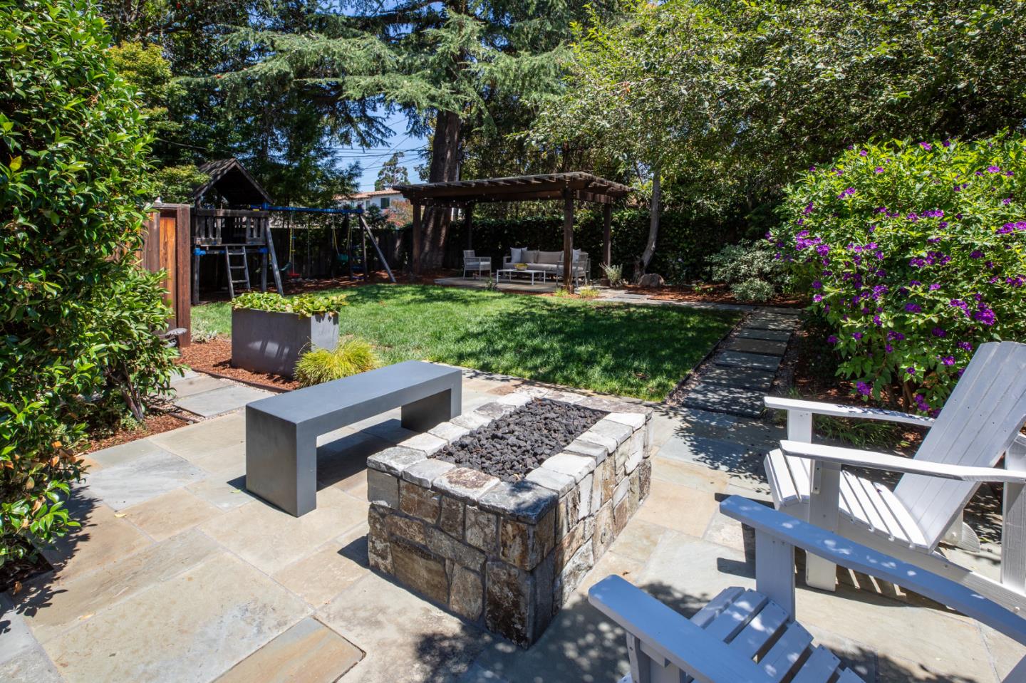 115 Walnut Street Menlo Park, CA 94025 - Photo 11 of 12 a view of a patio with table and chairs potted plants and large tree