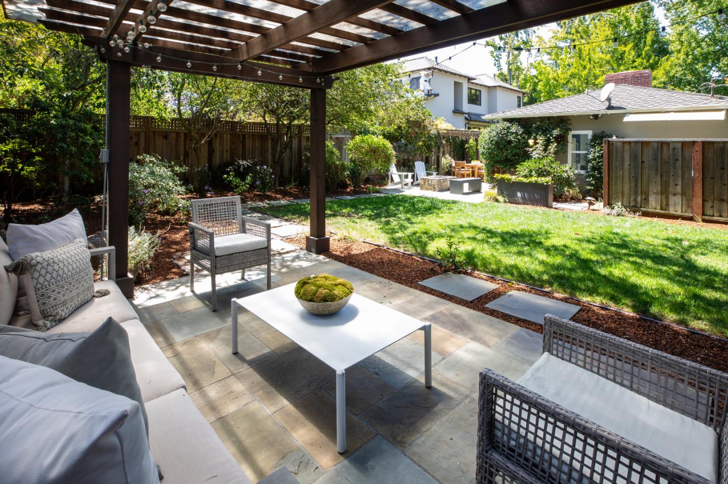 115 Walnut Street Menlo Park, CA 94025 - Photo 12 of 12 a view of a patio with a table chairs and a backyard