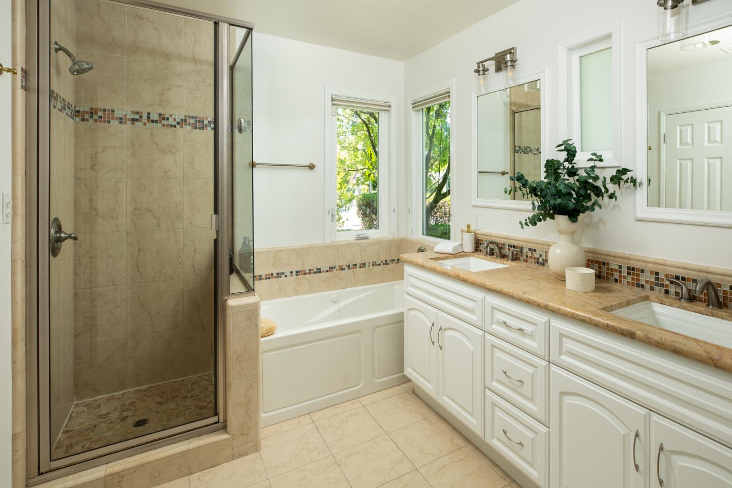 115 Walnut Street Menlo Park, CA 94025 - Photo 9 of 12 a bathroom with a granite countertop sink a mirror a window and a shower