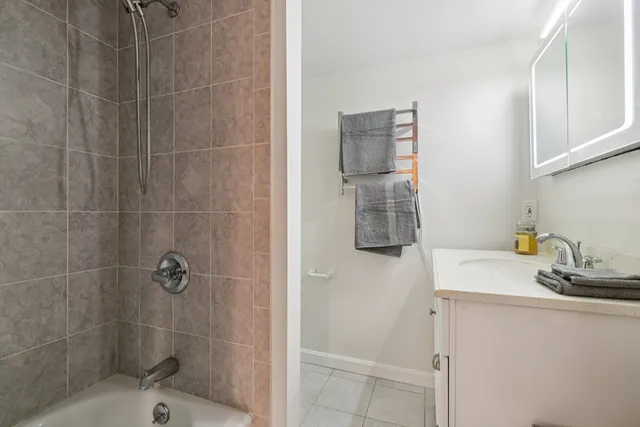 a bathroom with a sink and a shower