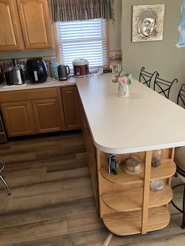 a view of kitchen with wooden floor