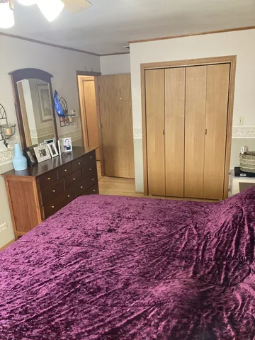 a bed room with a bed and a lamp