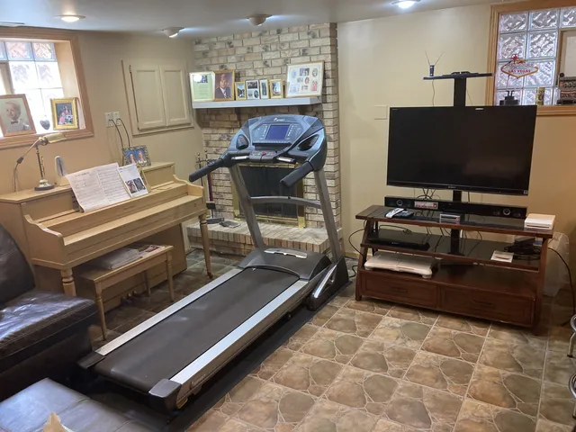 a living room with couches and a flat screen tv