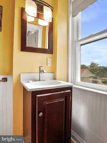 a view of a sink from a mirror