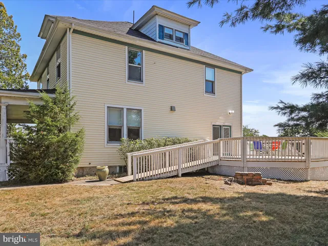 a front view of a house with a fence