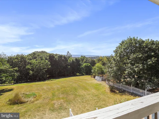 a view of a swimming pool with an outdoor seating