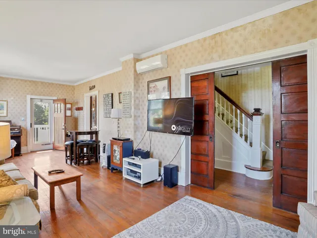 a living room with furniture and a table