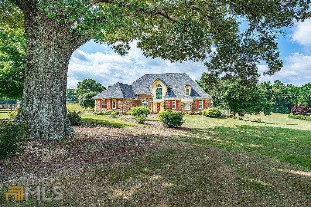 1497 Bullard Road, Unit 4 Powder Springs, GA 30127 - Photo 1 of 1 a front view of house with yard and green space