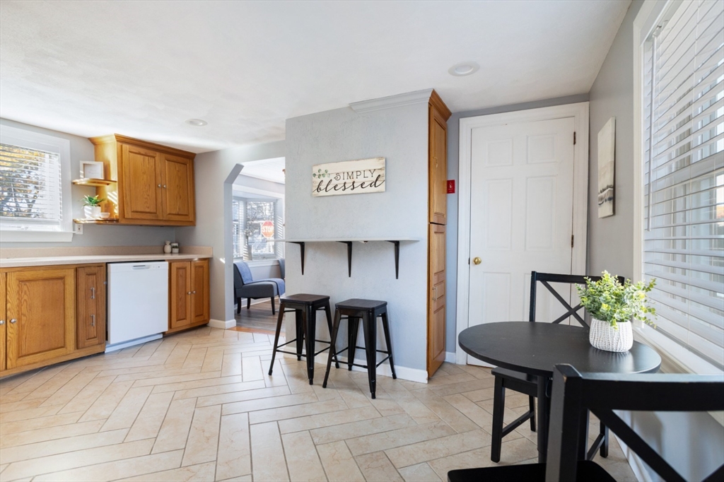 22 Laconia Avenue Saugus, MA 01906 - Photo 14 of 36 a living room with stainless steel appliances kitchen island granite countertop furniture and a dining table