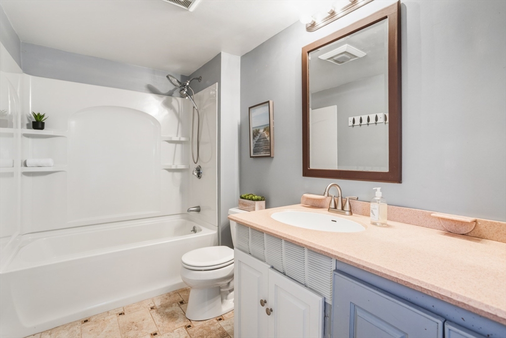 22 Laconia Avenue Saugus, MA 01906 - Photo 18 of 36 a bathroom with a sink a toilet and shower