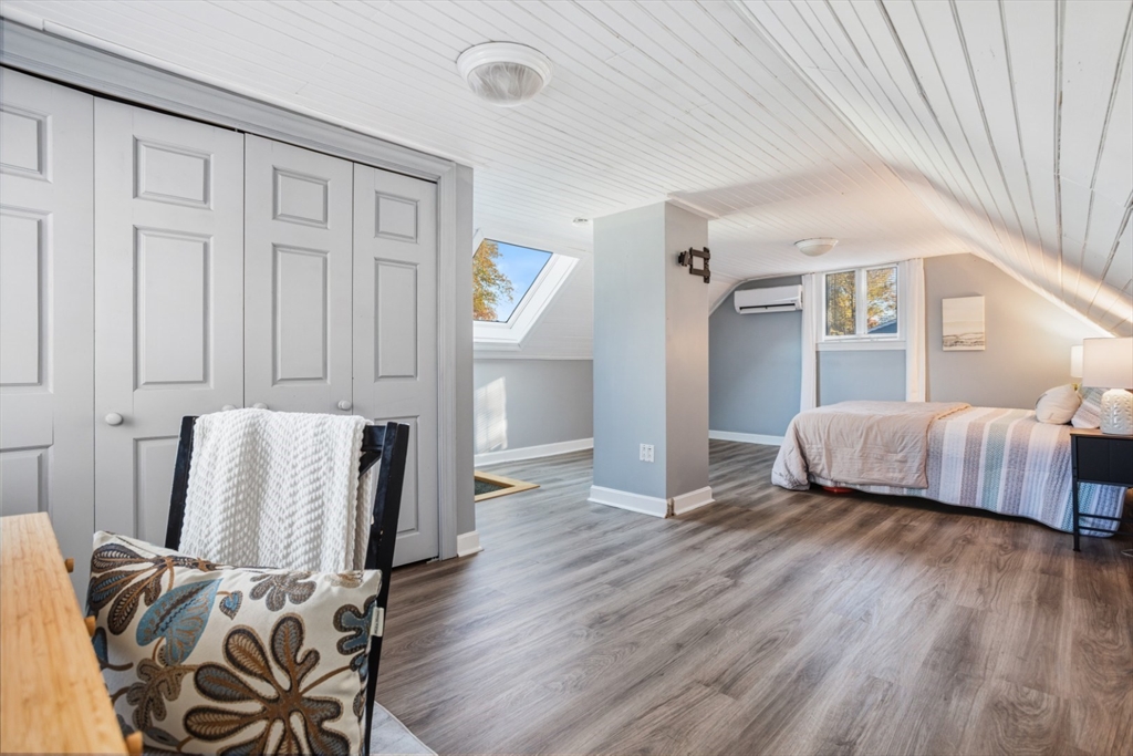 22 Laconia Avenue Saugus, MA 01906 - Photo 22 of 36 a view of a bedroom with furniture and wooden floor