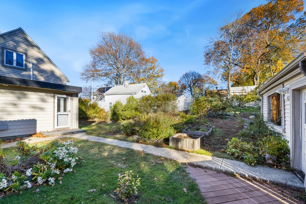 22 Laconia Avenue Saugus, MA 01906 - Photo 33 of 36 a view of a house with a yard and garden