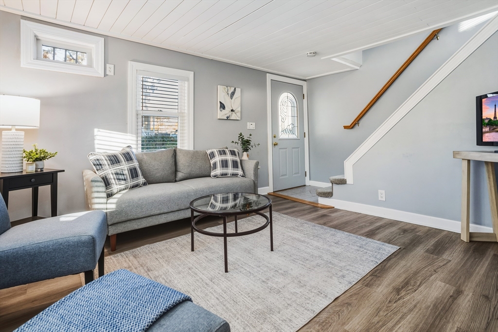 22 Laconia Avenue Saugus, MA 01906 - Photo 8 of 36 a living room with furniture and a wooden floor