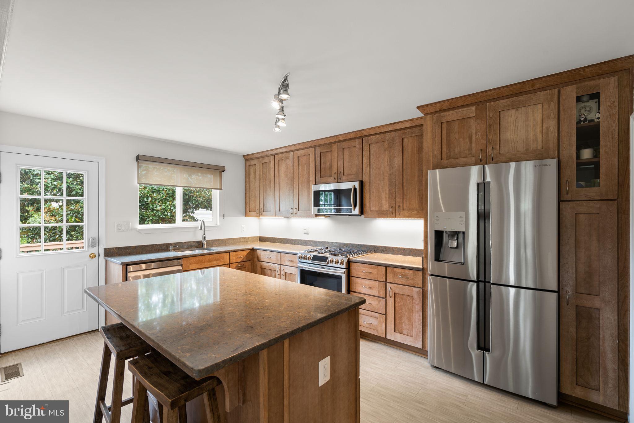 48 Oswego Avenue Silver Spring, MD 20912 - Photo 11 of 32 Gas stove & luxury vinyl tile flooring