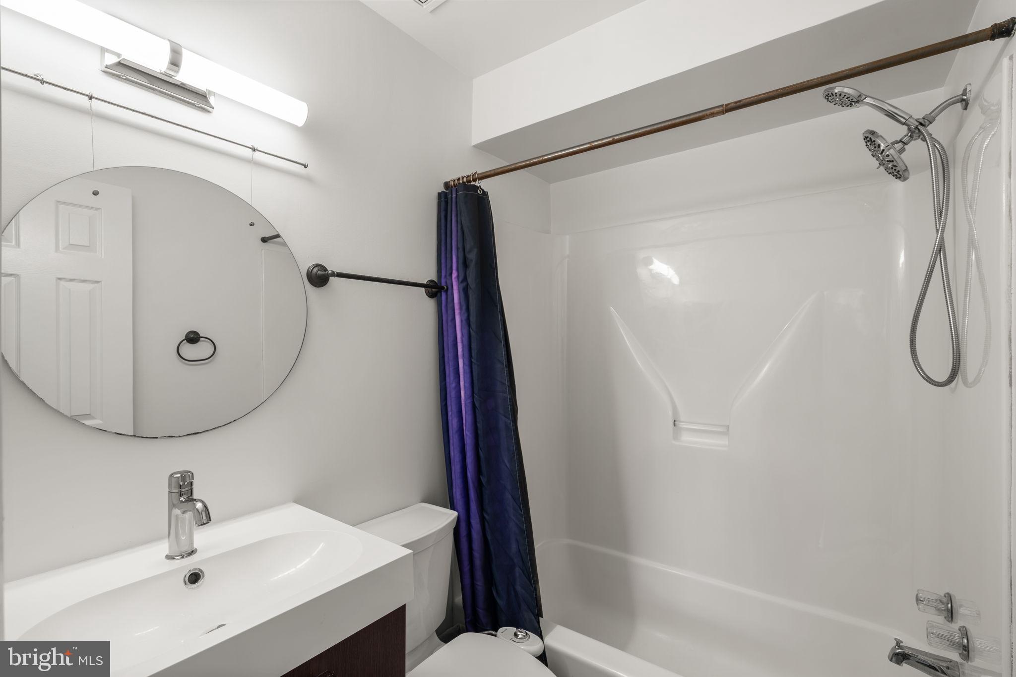 48 Oswego Avenue Silver Spring, MD 20912 - Photo 25 of 32 Primary en-suite bathroom with tub/shower combo