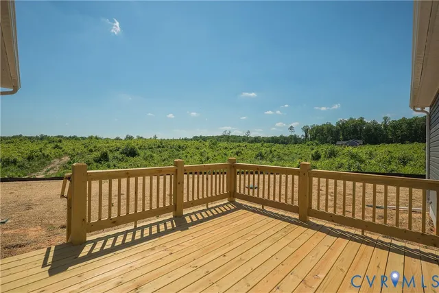 a view of balcony with wooden floor and fence