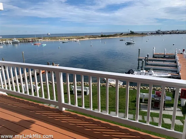 a view of a balcony with wooden floor and city view