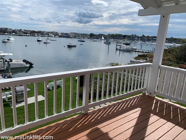 a view of a balcony with wooden floor