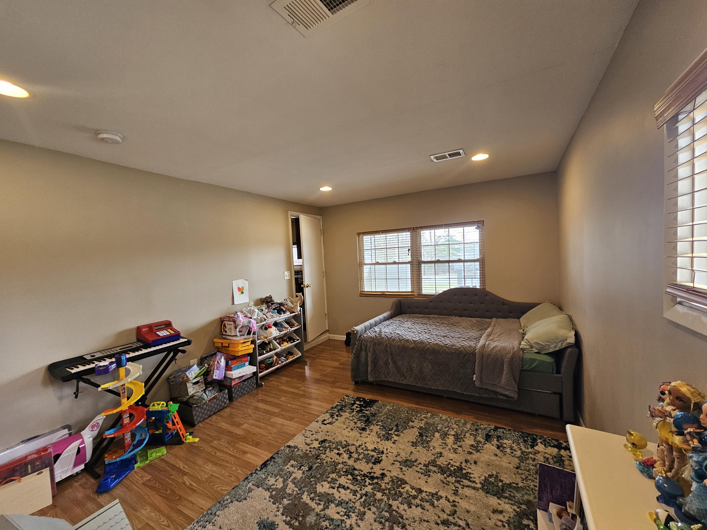 117 Cross Street Pocono Lake, PA 18347 - Photo 11 of 26 a bedroom with furniture and a window