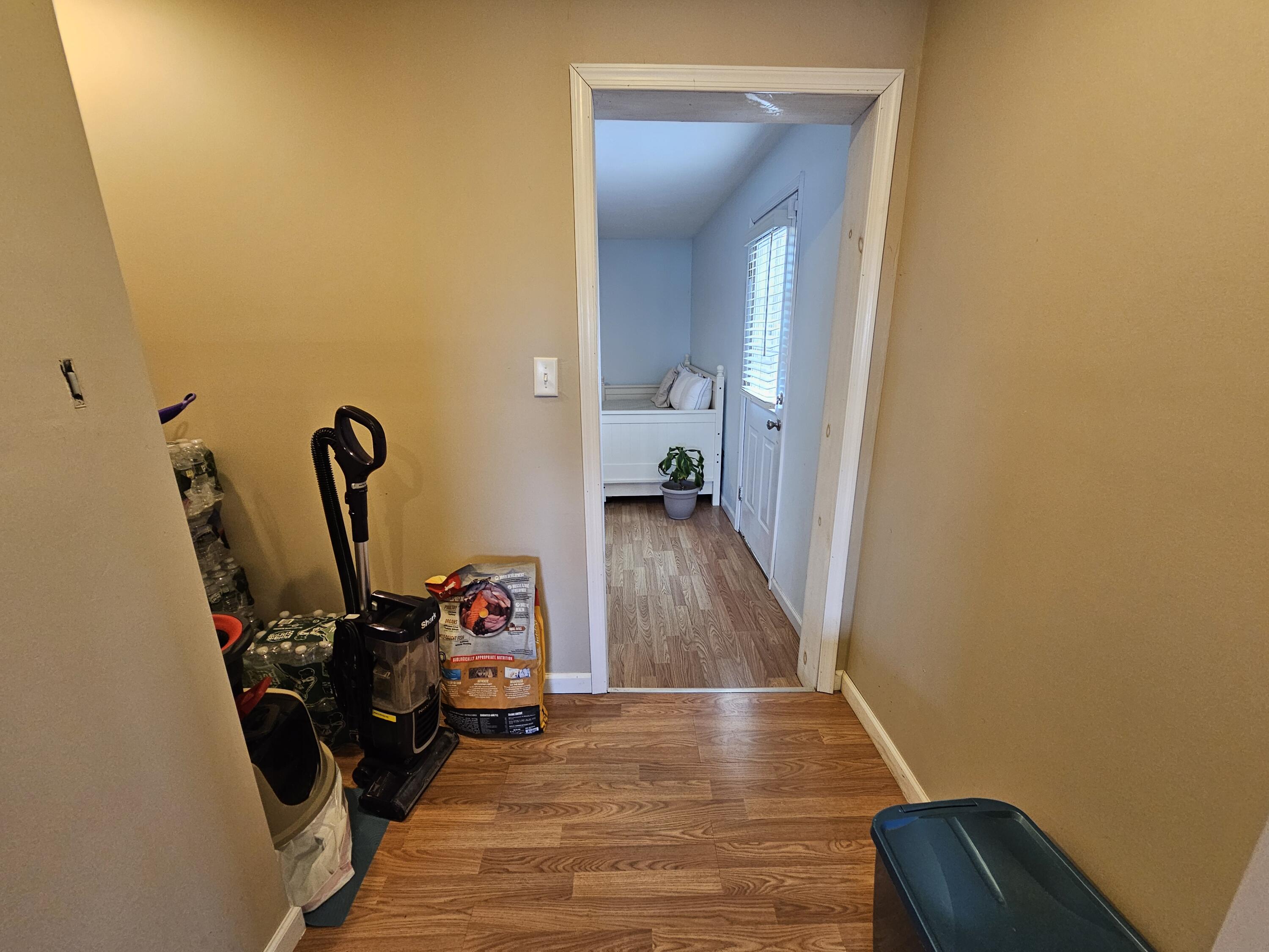 117 Cross Street Pocono Lake, PA 18347 - Photo 12 of 26 a view of a hallway with wooden floor and a mirror