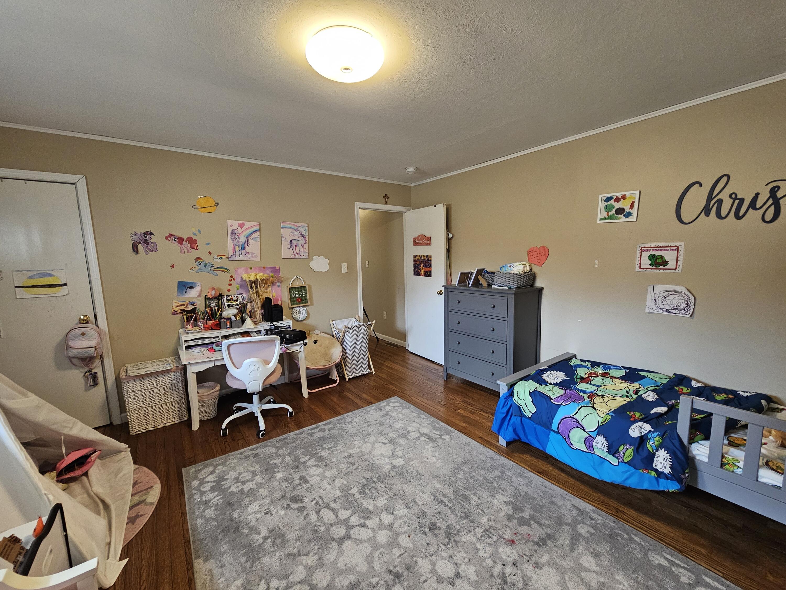 117 Cross Street Pocono Lake, PA 18347 - Photo 18 of 26 a bedroom with furniture and a wooden floor