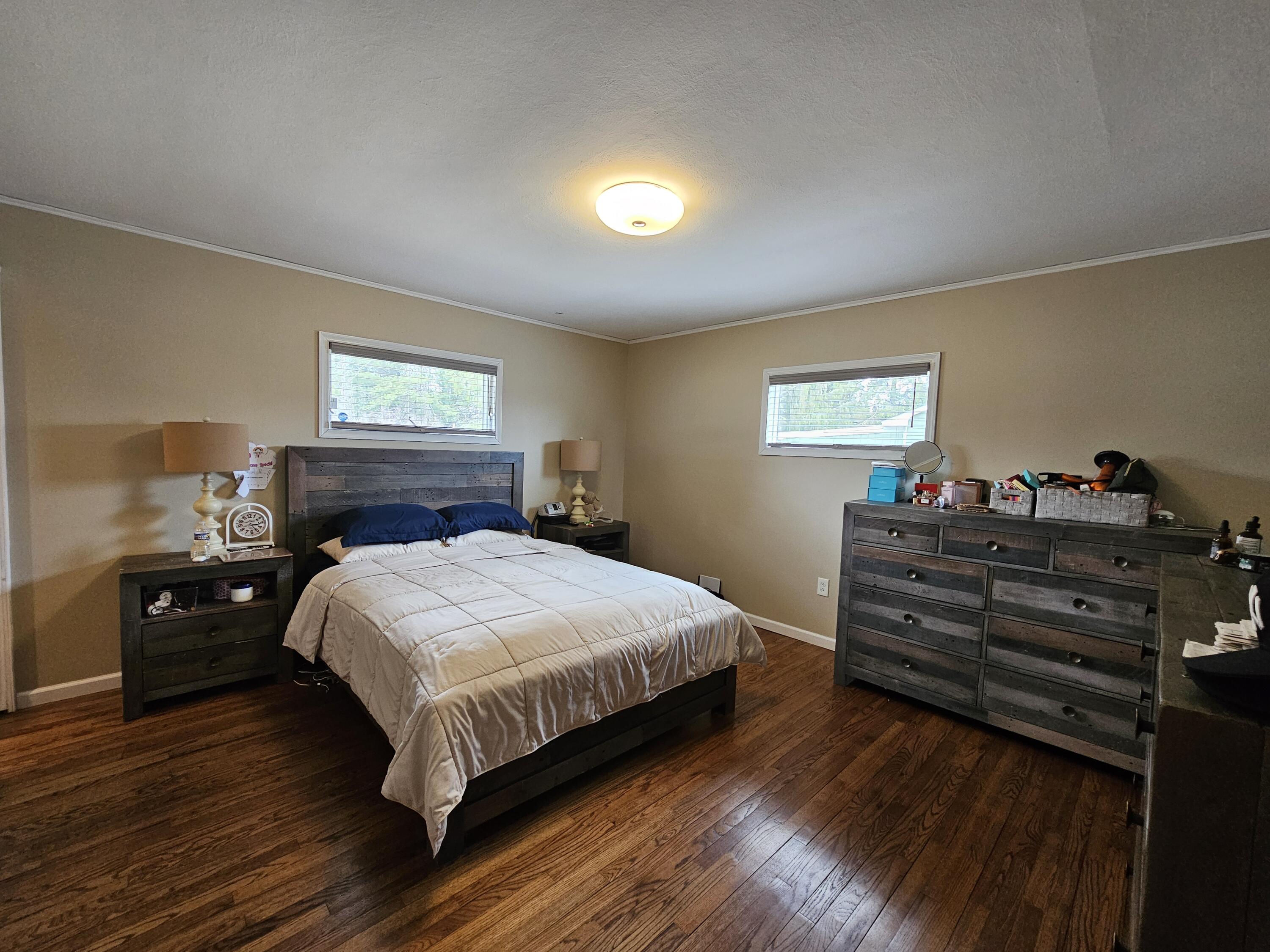 117 Cross Street Pocono Lake, PA 18347 - Photo 22 of 26 a bedroom with a bed and wooden floor