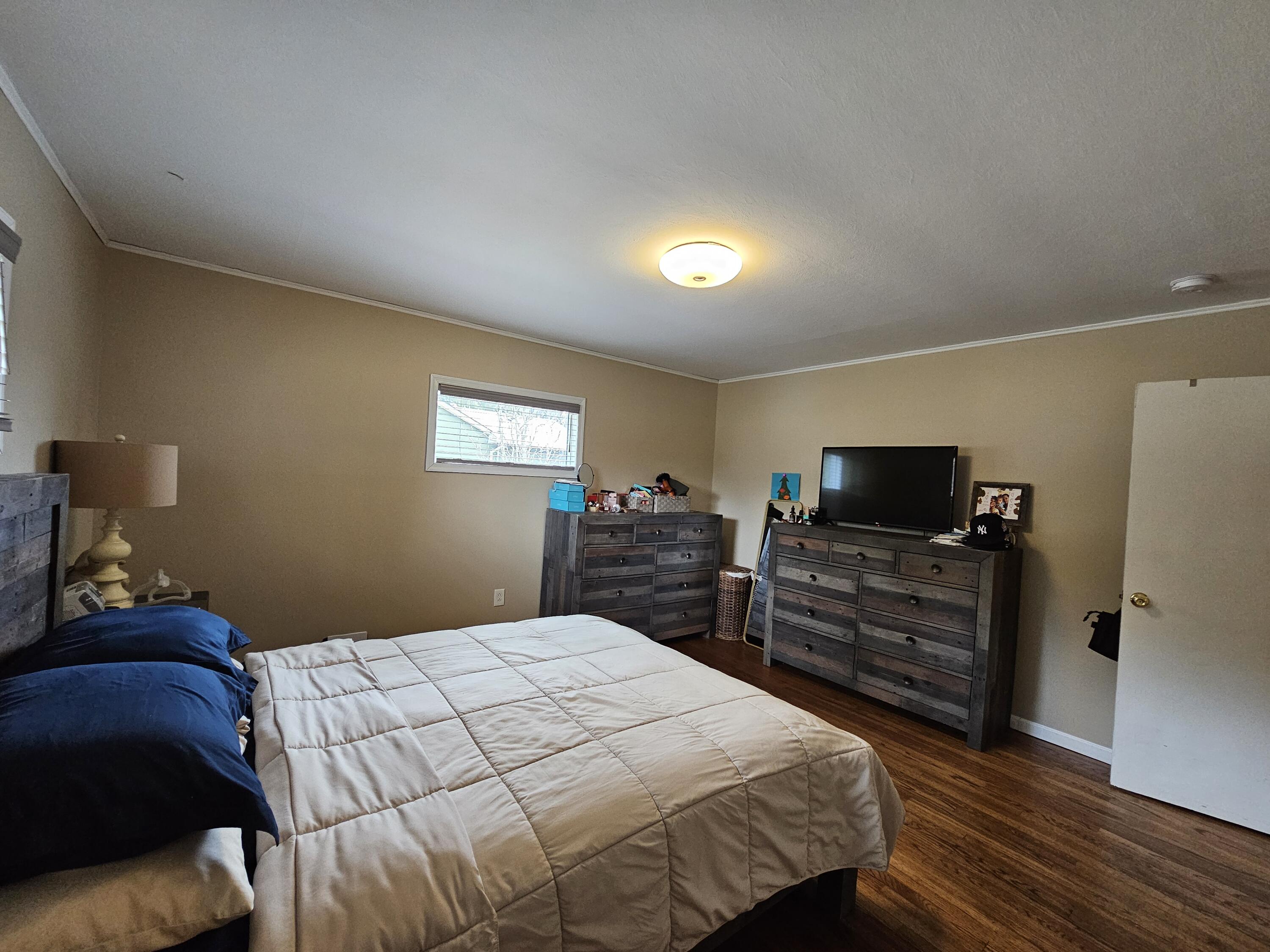 117 Cross Street Pocono Lake, PA 18347 - Photo 23 of 26 a bedroom with a bed and a flat screen tv