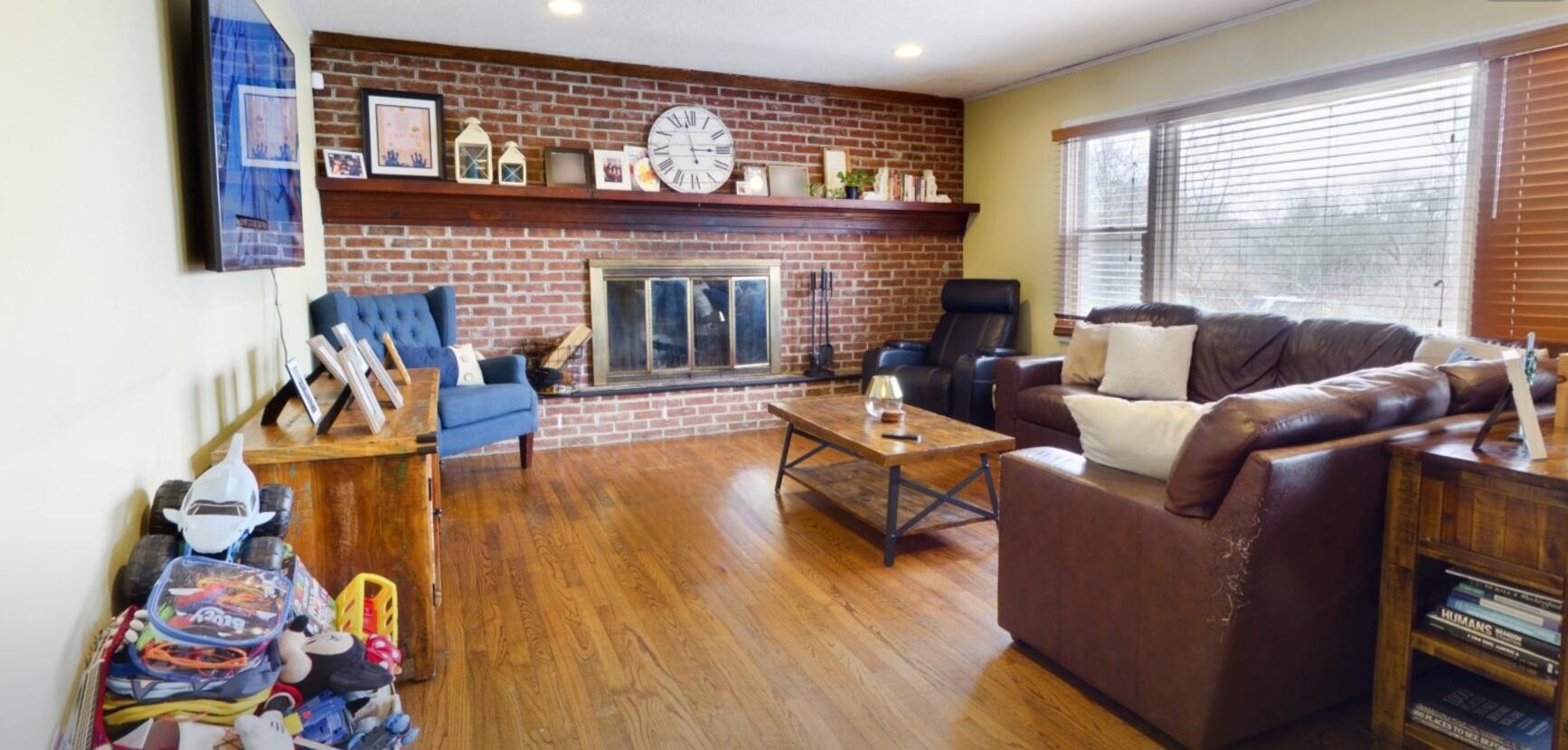 117 Cross Street Pocono Lake, PA 18347 - Photo 8 of 26 a living room with furniture and a fireplace