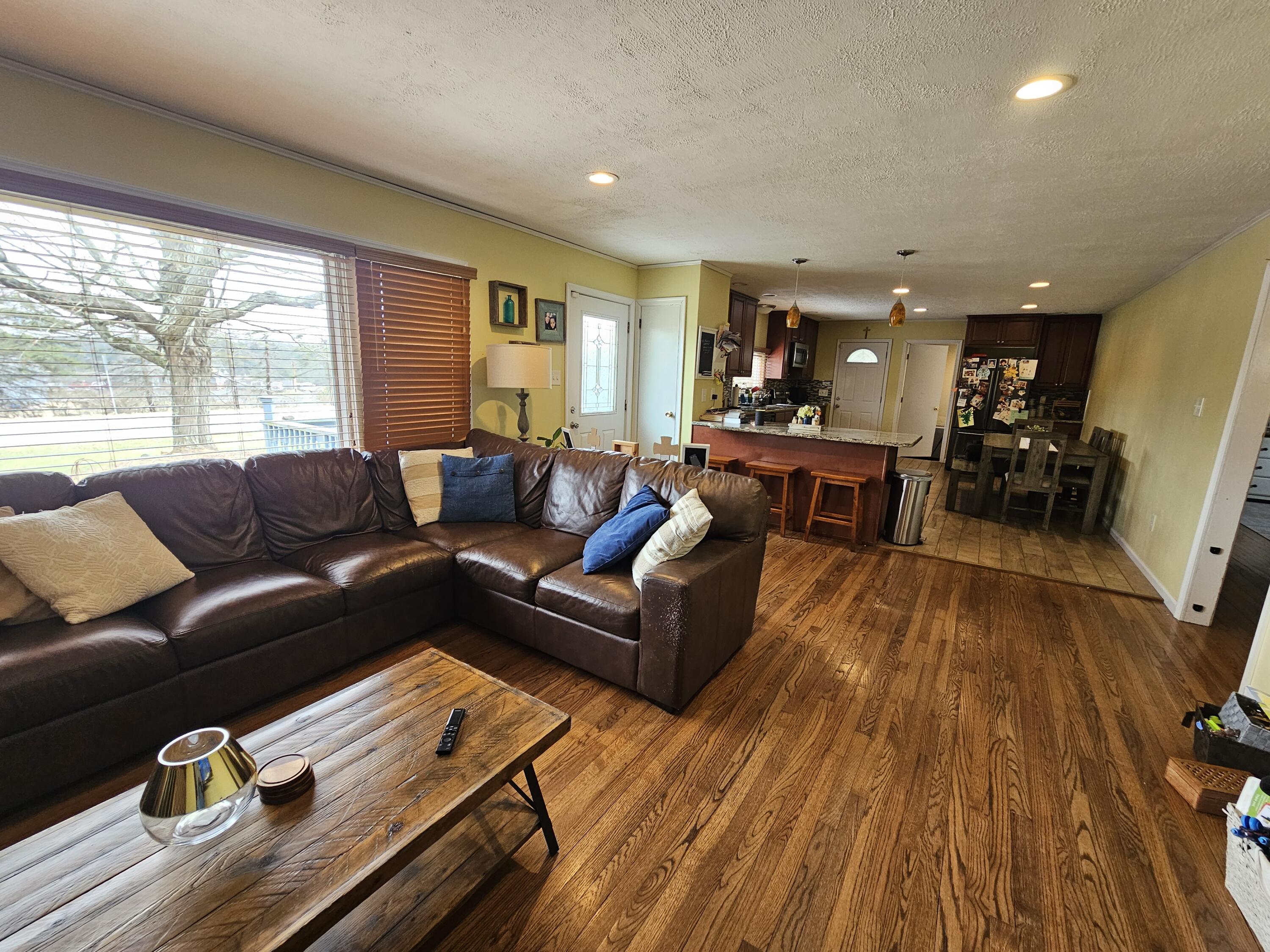 117 Cross Street Pocono Lake, PA 18347 - Photo 9 of 26 a living room with furniture and a wooden floor