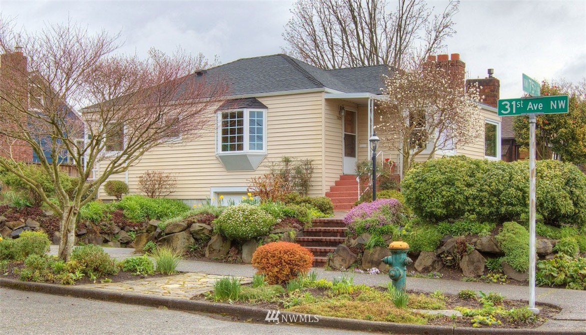 3020 Northwest 75th Street Seattle, WA 98117 - Photo 1 of 22 a front view of a house with garden