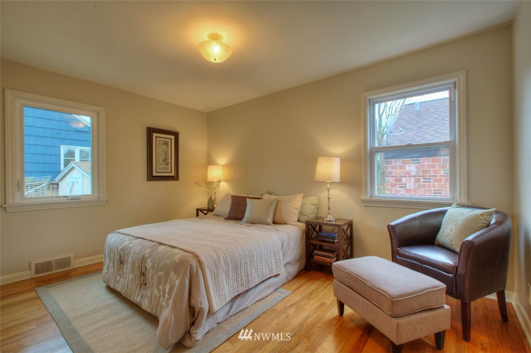 3020 Northwest 75th Street Seattle, WA 98117 - Photo 11 of 22 a bedroom with a bed couch and a window