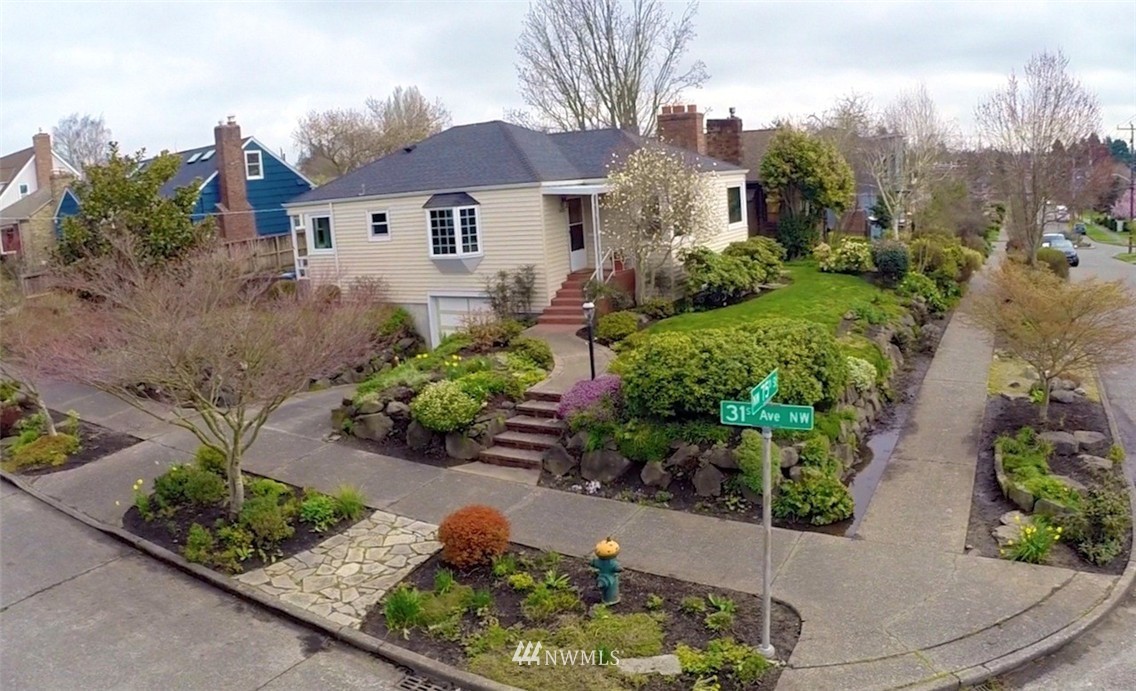 3020 Northwest 75th Street Seattle, WA 98117 - Photo 22 of 22 a front view of a house with a yard and a garden