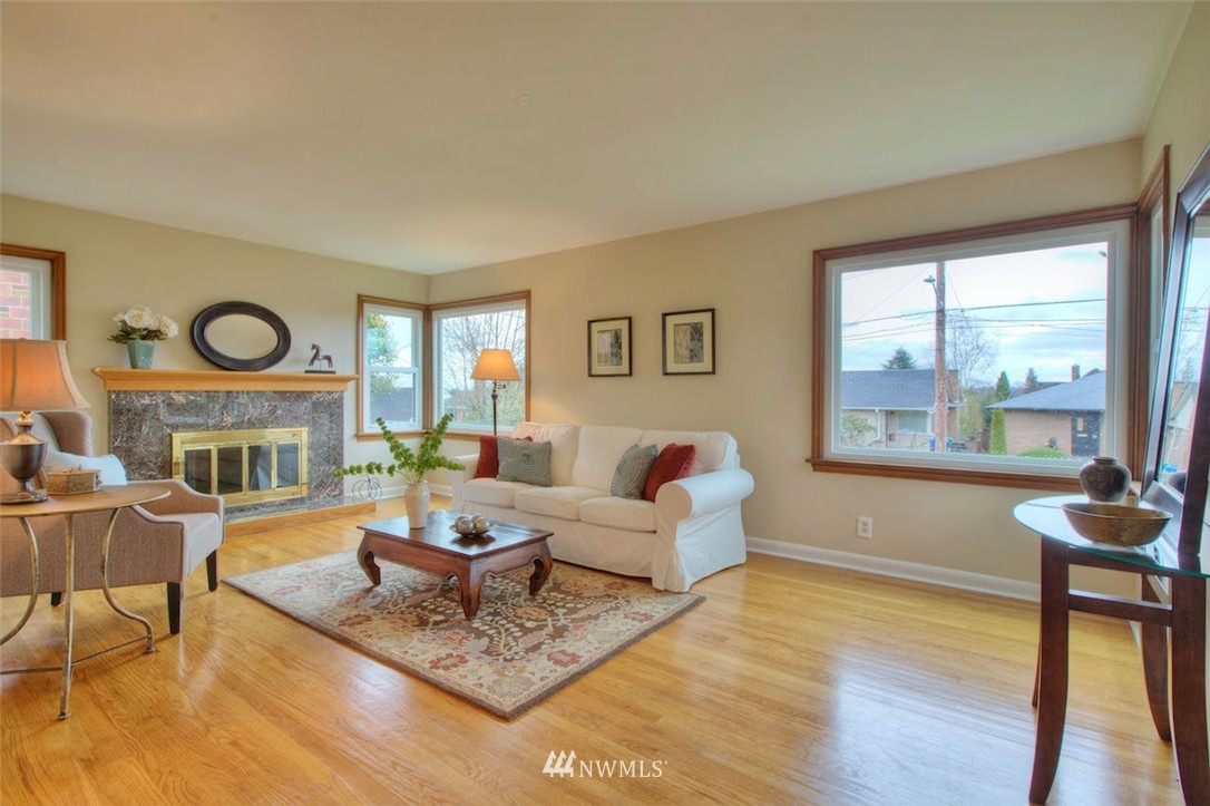 3020 Northwest 75th Street Seattle, WA 98117 - Photo 4 of 22 a living room with fireplace furniture and a large window