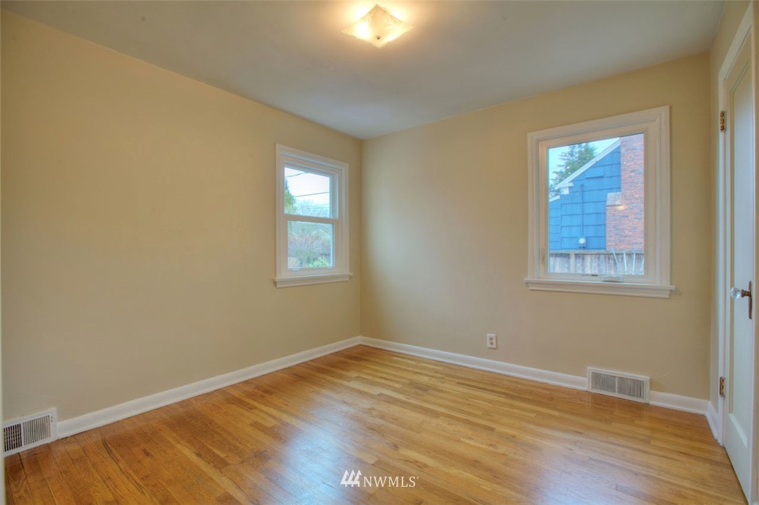 3020 Northwest 75th Street Seattle, WA 98117 - Photo 10 of 22 a view of empty room with wooden floor and fan